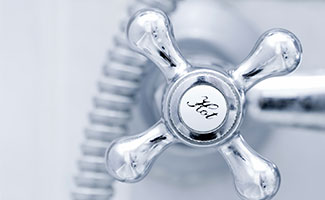 close-up of hot water fixture handle